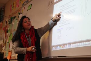 Spanish teacher Analia Carter goes over the bell work with her spanish one class. Photo by Tayler Brown.