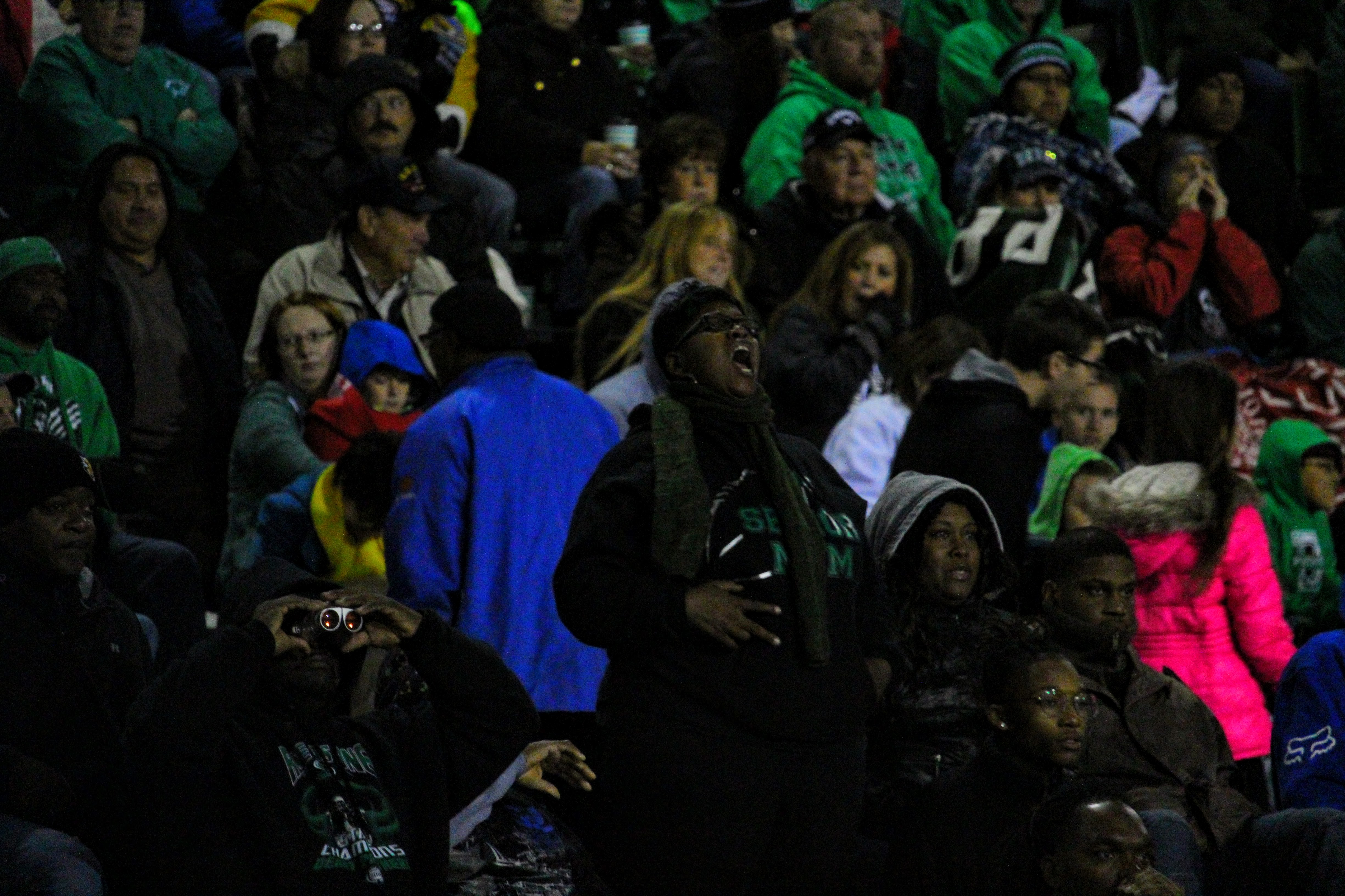 Peerlus Walker’s mom hollers from the stands during a home game at Panther Stadium.