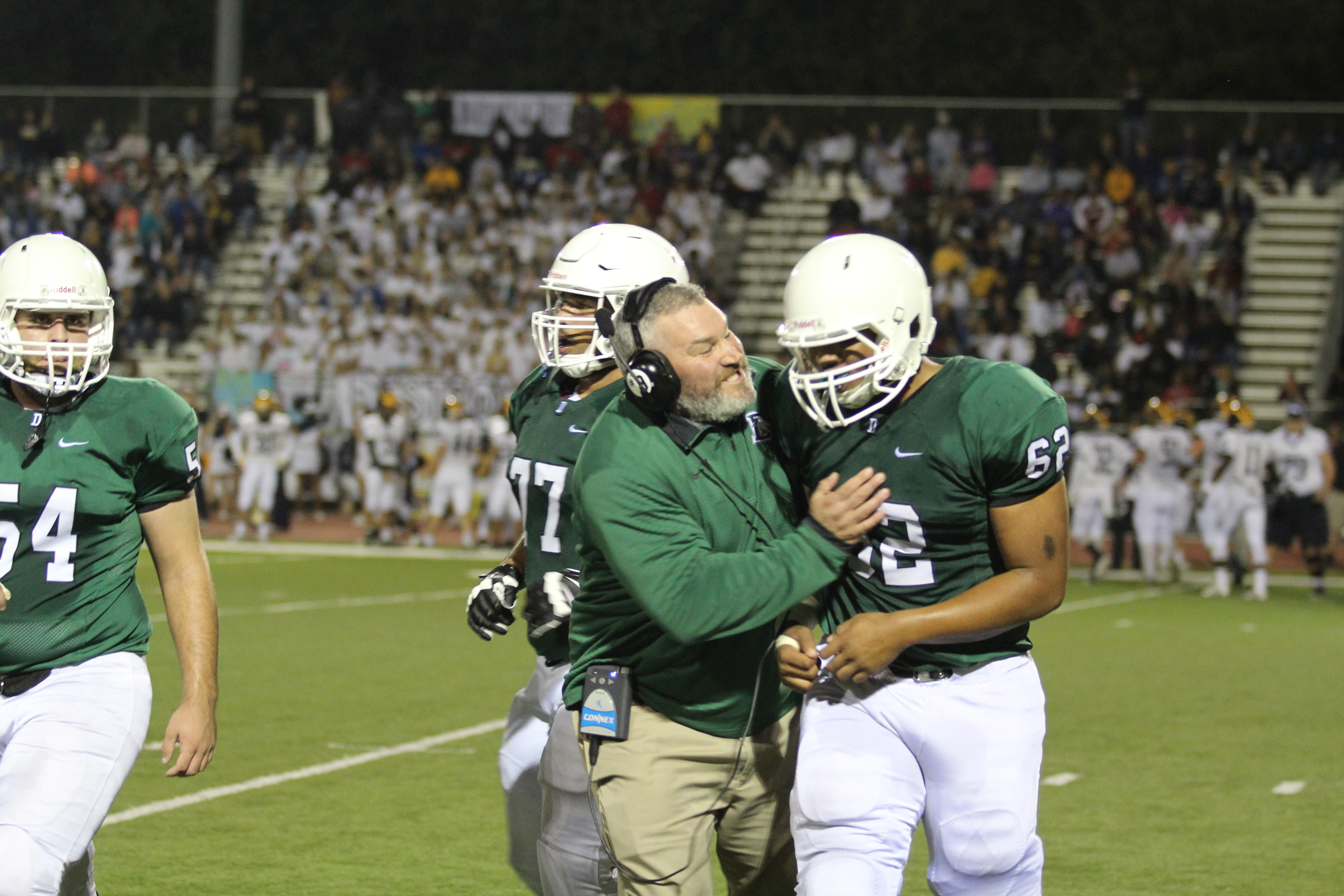 Big hugs after a big play from junior Evan Clark during the first playoff game vs Wichita Northwest