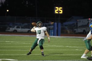 Senior Dan Dawdy looks downfield to throw the football during the Panthers game at Hutch.